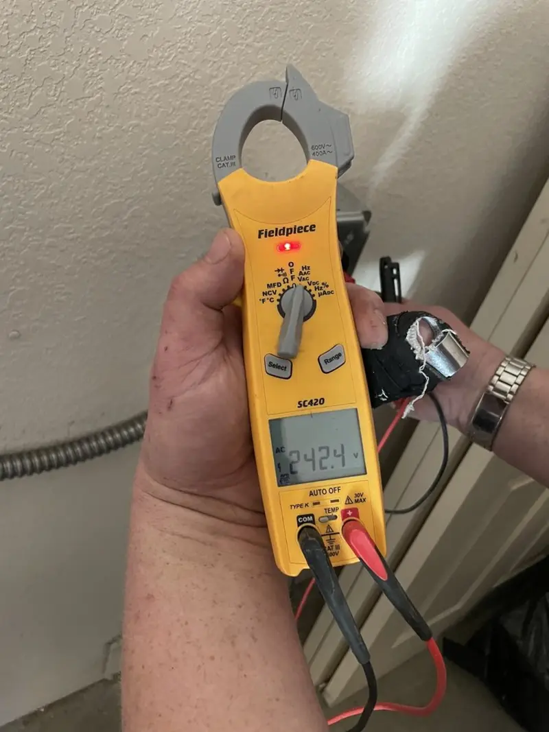 Voltage testing with clamp meter during Ceiling Fan Installation in Pontotoc
